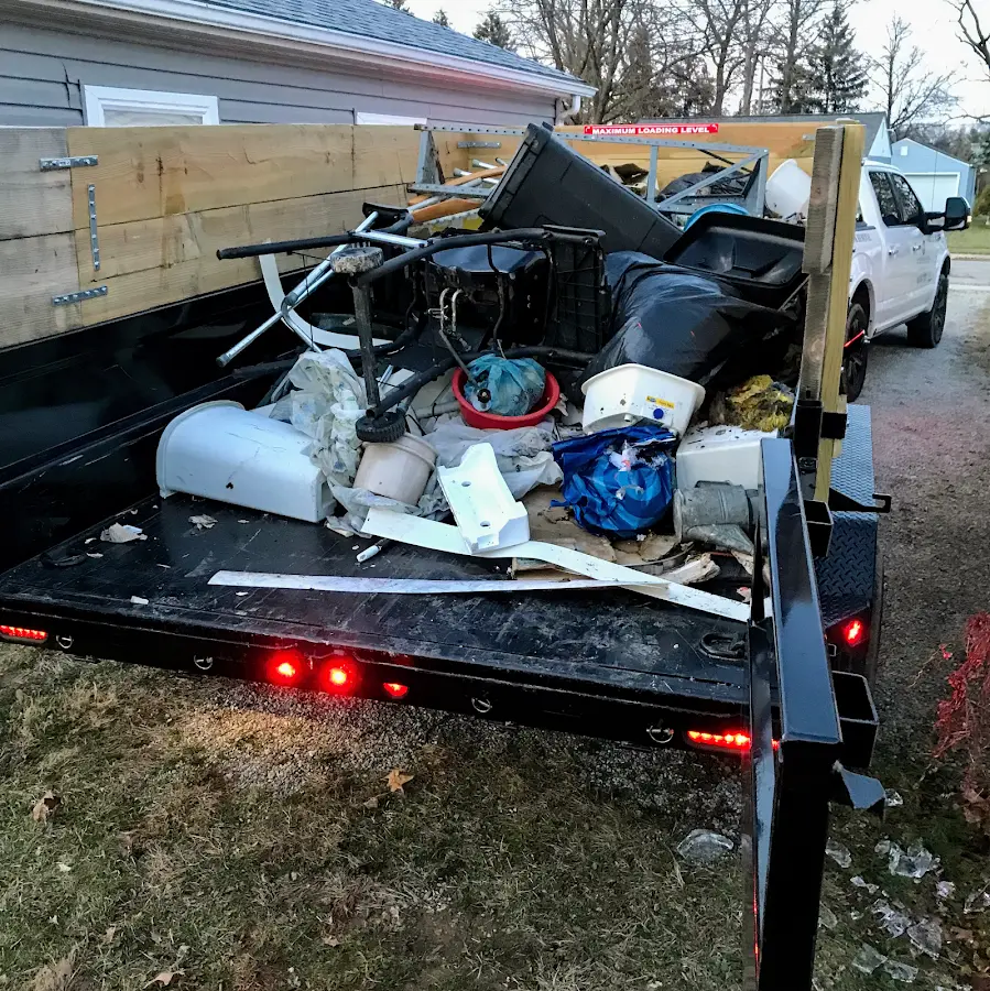 Roll-off dumpster delivered to a residential driveway in Valdez